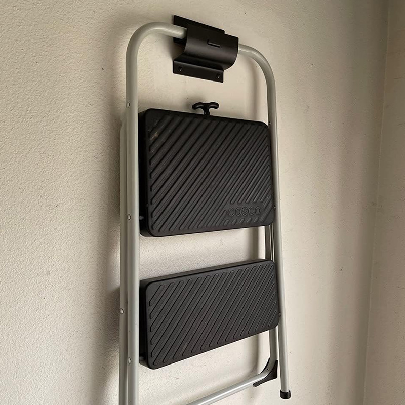 Heavy-duty ladder hooks on the garage wall for folding chairs, shed tool rack