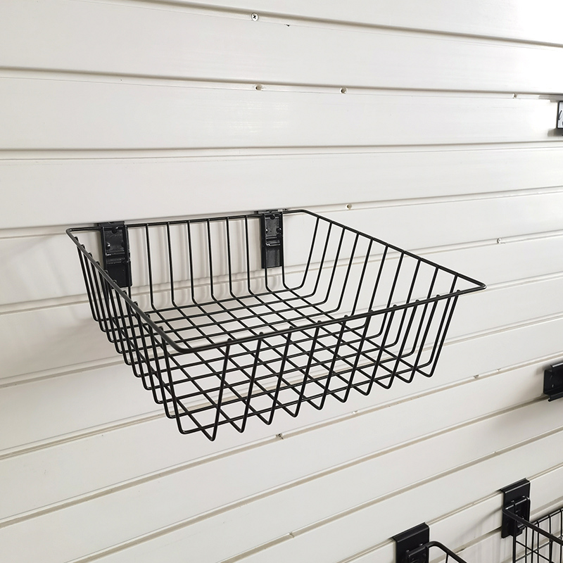 Basket for storage of ironwork items on a slatted wall, no nails required