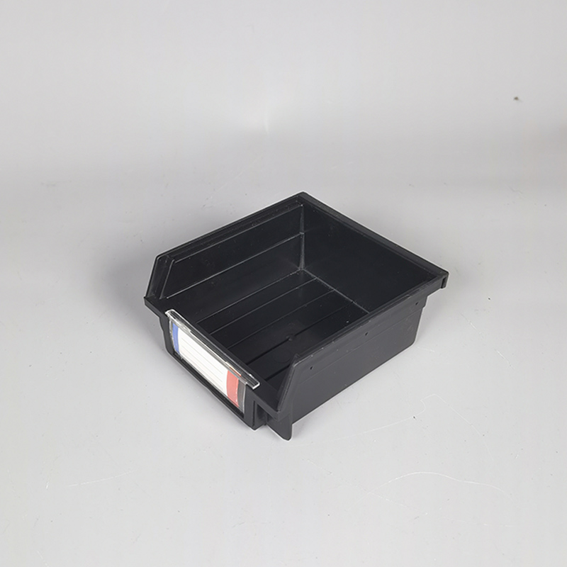 Plastic storage box with slanting parts hanging on the back of the hole board