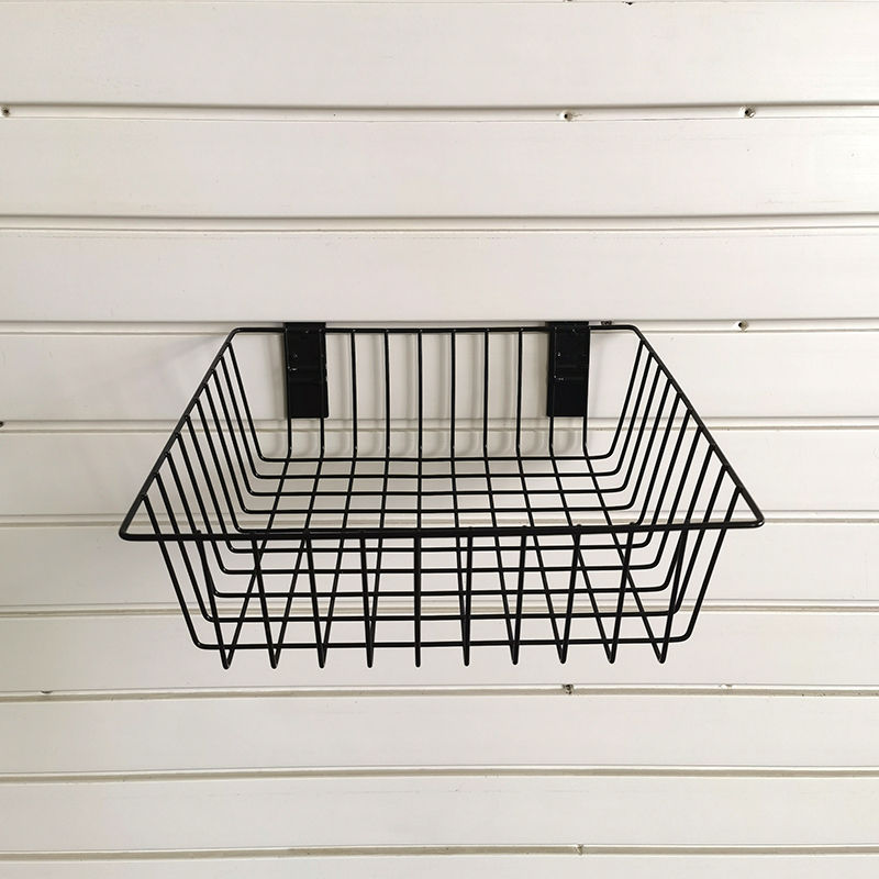 Basket for storage of ironwork items on a slatted wall, no nails required