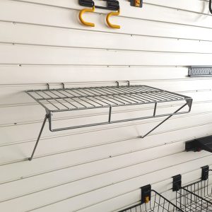 Slat wall storage shelf for warehouse storage room