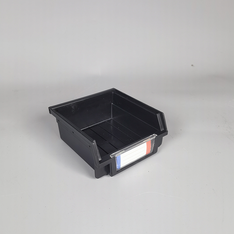 Plastic storage box with slanting parts hanging on the back of the hole board