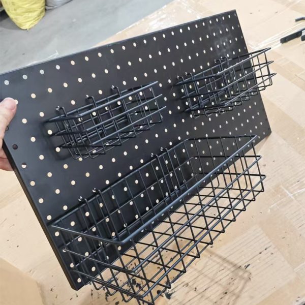 A mesh basket on a perforated board