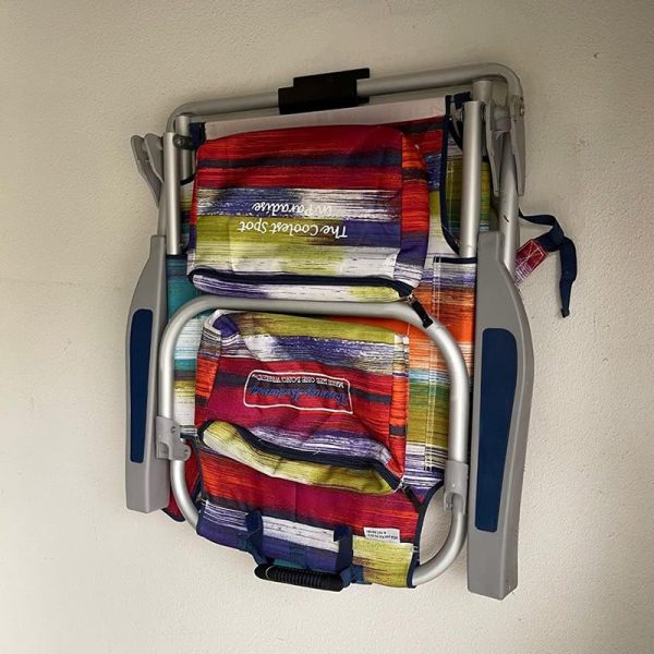 Heavy-duty ladder hooks on the garage wall for folding chairs, shed tool rack