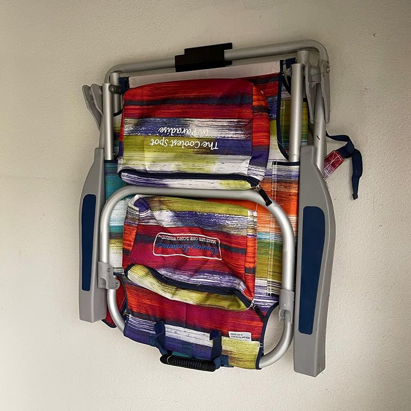 Heavy-duty ladder hooks on the garage wall for folding chairs, shed tool rack