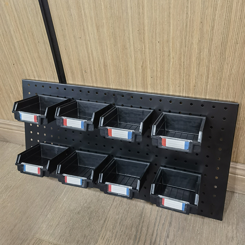 Plastic storage box with slanting parts hanging on the back of the hole board