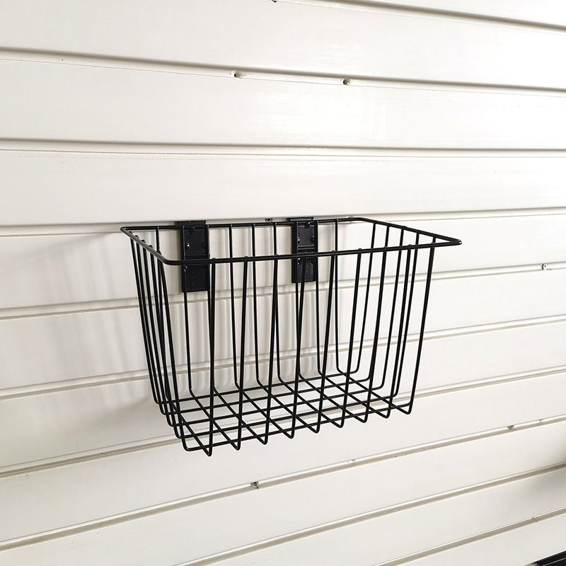 Basket for storage of ironwork items on a slatted wall, no nails required