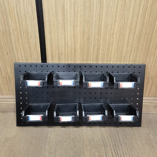 Plastic storage box with slanting parts hanging on the back of the hole board