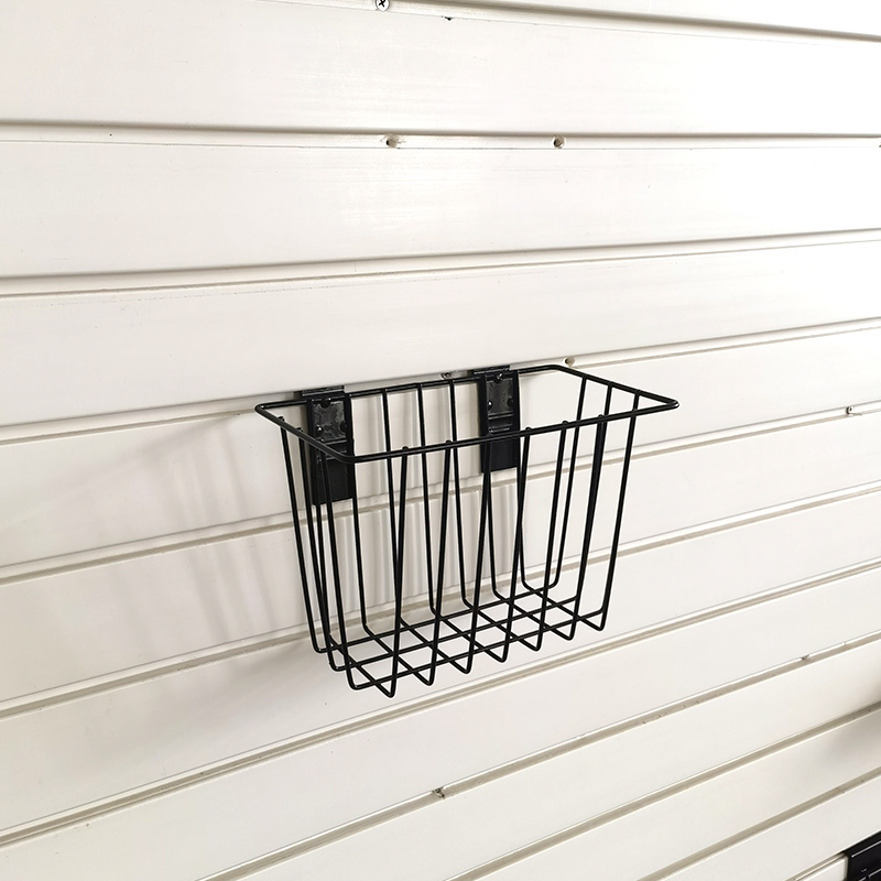 Basket for storage of ironwork items on a slatted wall, no nails required