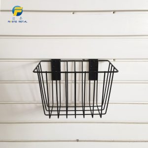 Basket for storage of ironwork items on a slatted wall, no nails required