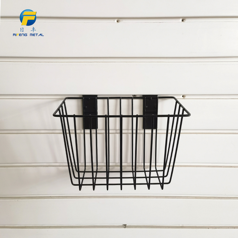 Basket for storage of ironwork items on a slatted wall, no nails required