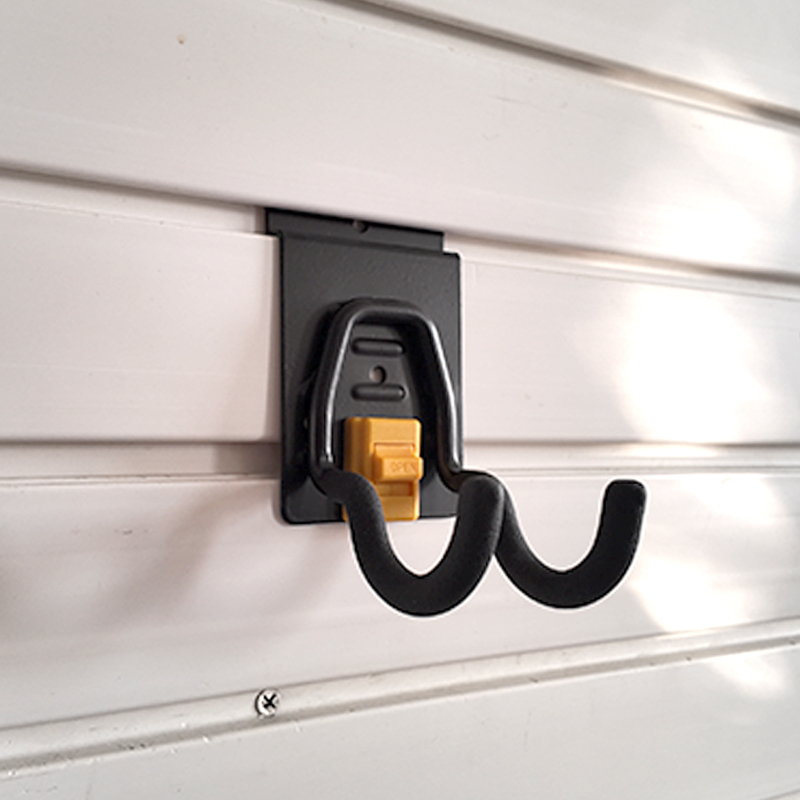 The small round hook on Slatwall is used for small electric tools in garages
