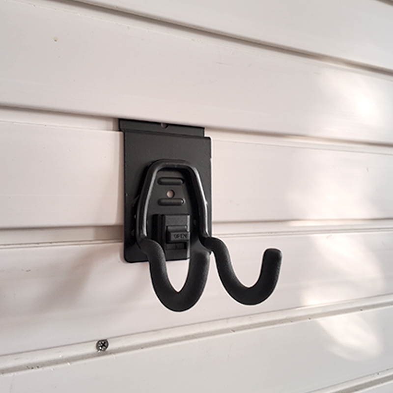 The small round hook on Slatwall is used for small electric tools in garages