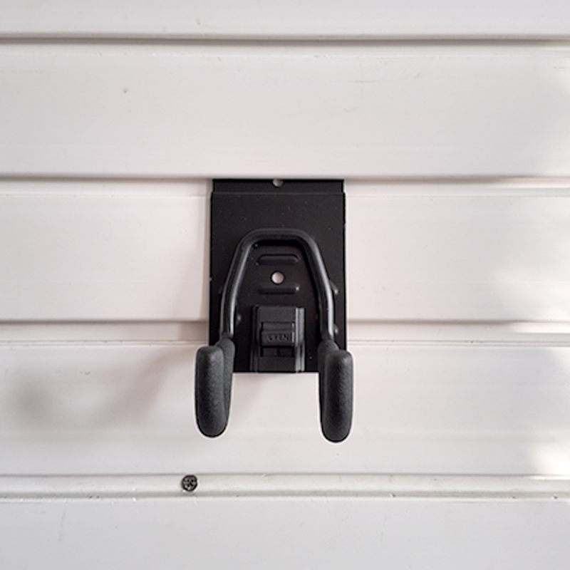The small round hook on Slatwall is used for small electric tools in garages