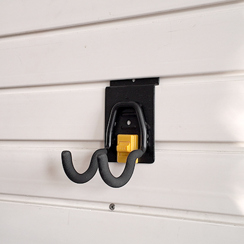 The small round hook on Slatwall is used for small electric tools in garages