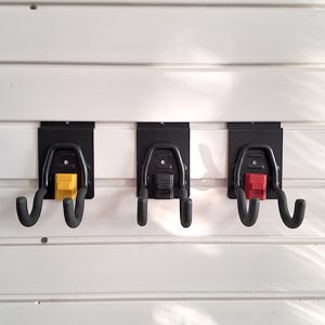 The small round hook on Slatwall is used for small electric tools in garages