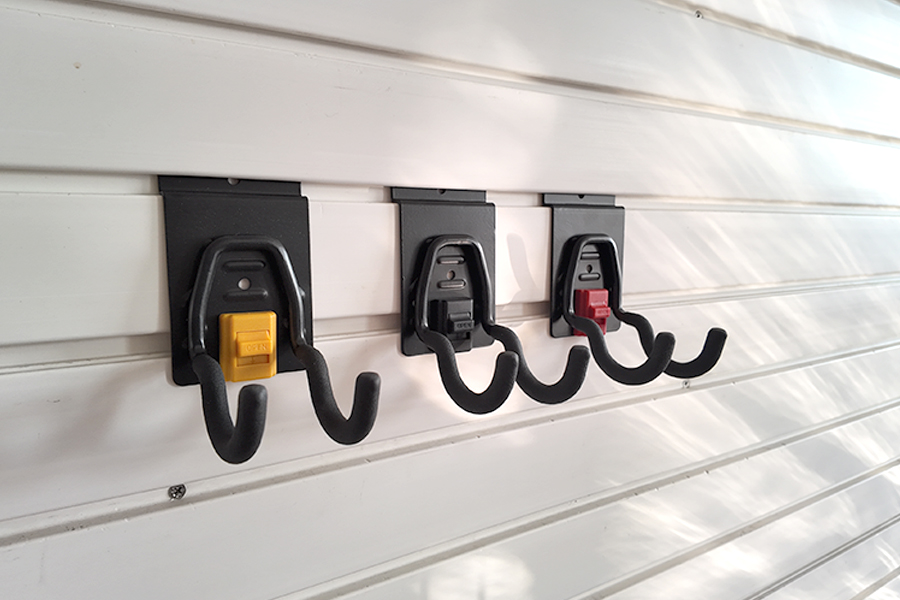 The small round hook on Slatwall is used for small electric tools in garages